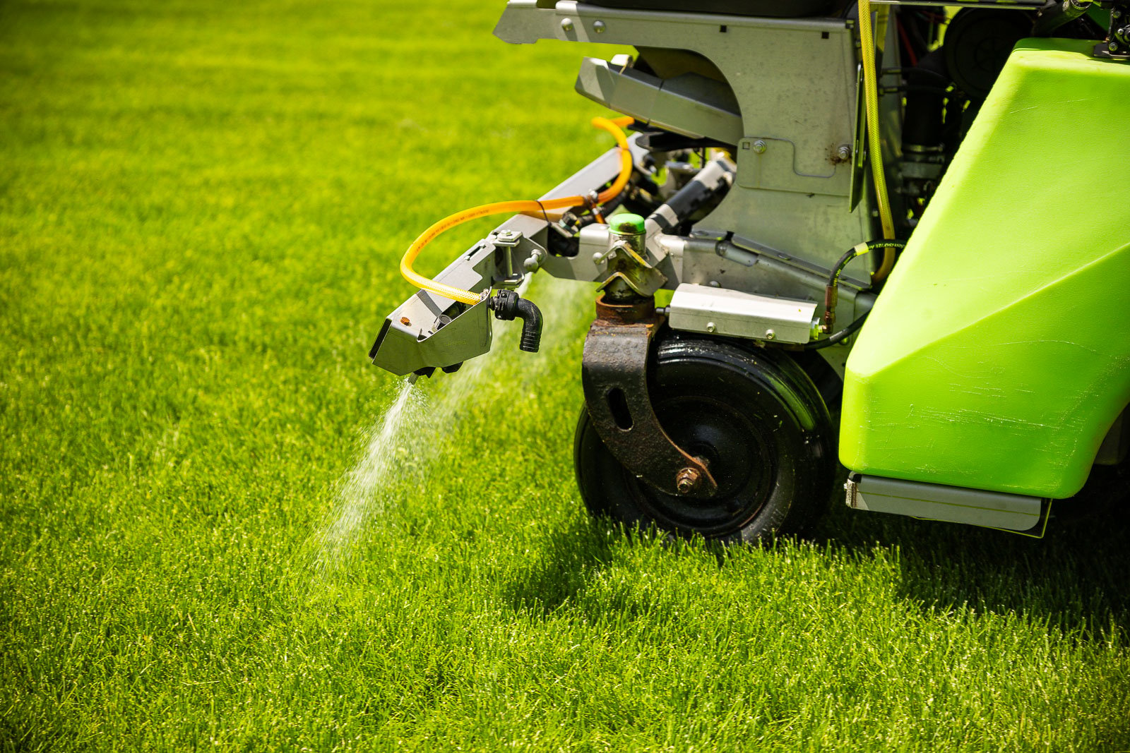 lawn care sprayer applying broadleaf weed control in nice yard 3