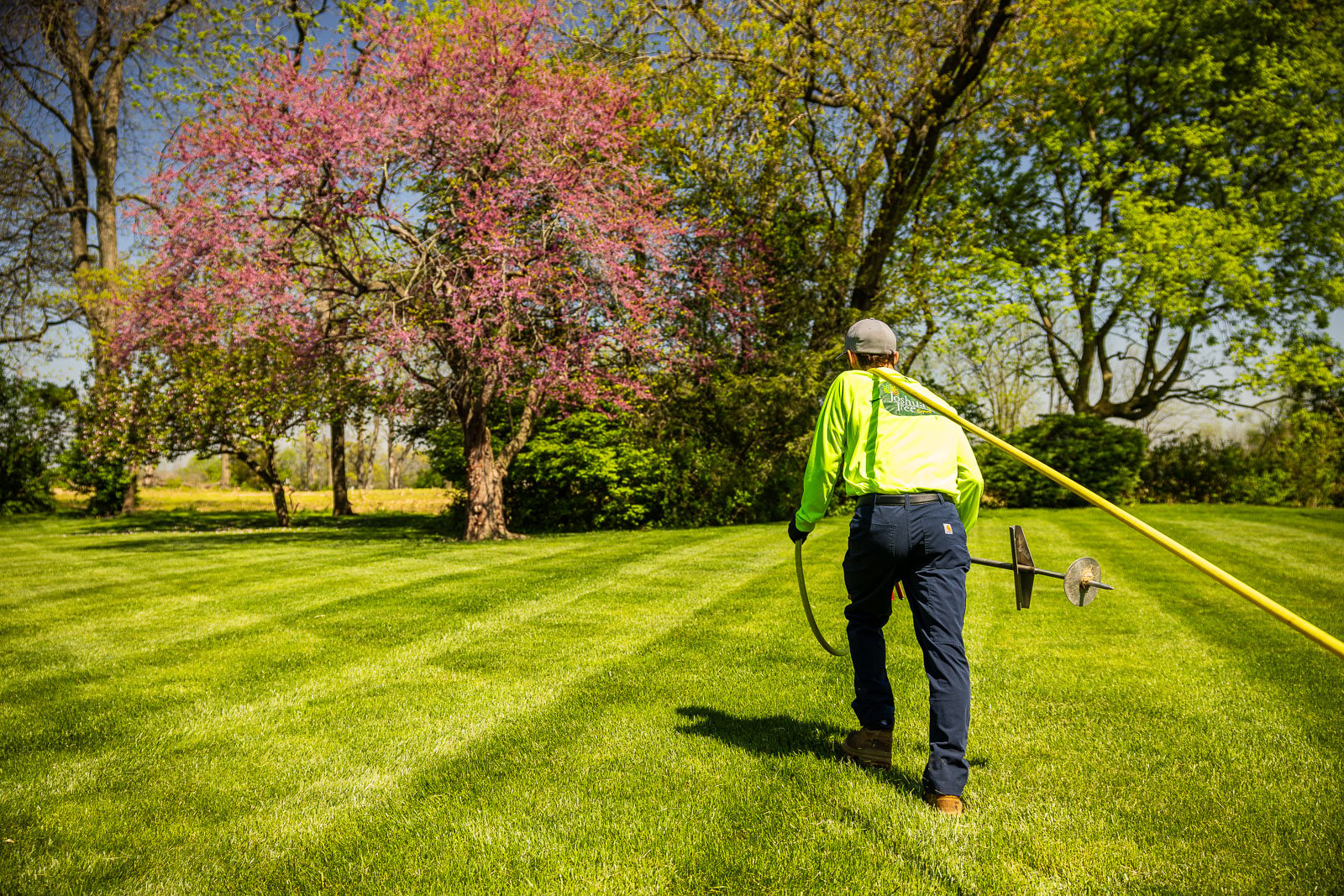 plant health care technician with truck and equipment preparing to spray planting beds 3