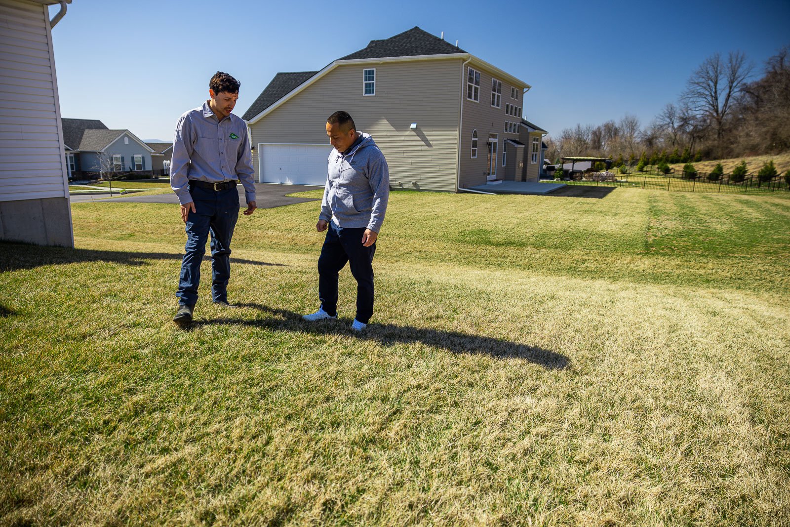 lawn care technician customer lawn inspection