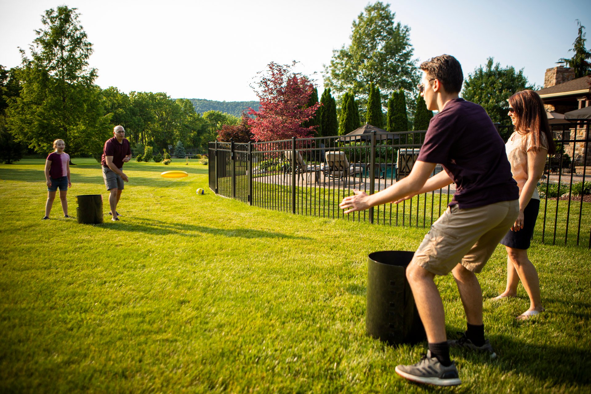 family playing in lawn